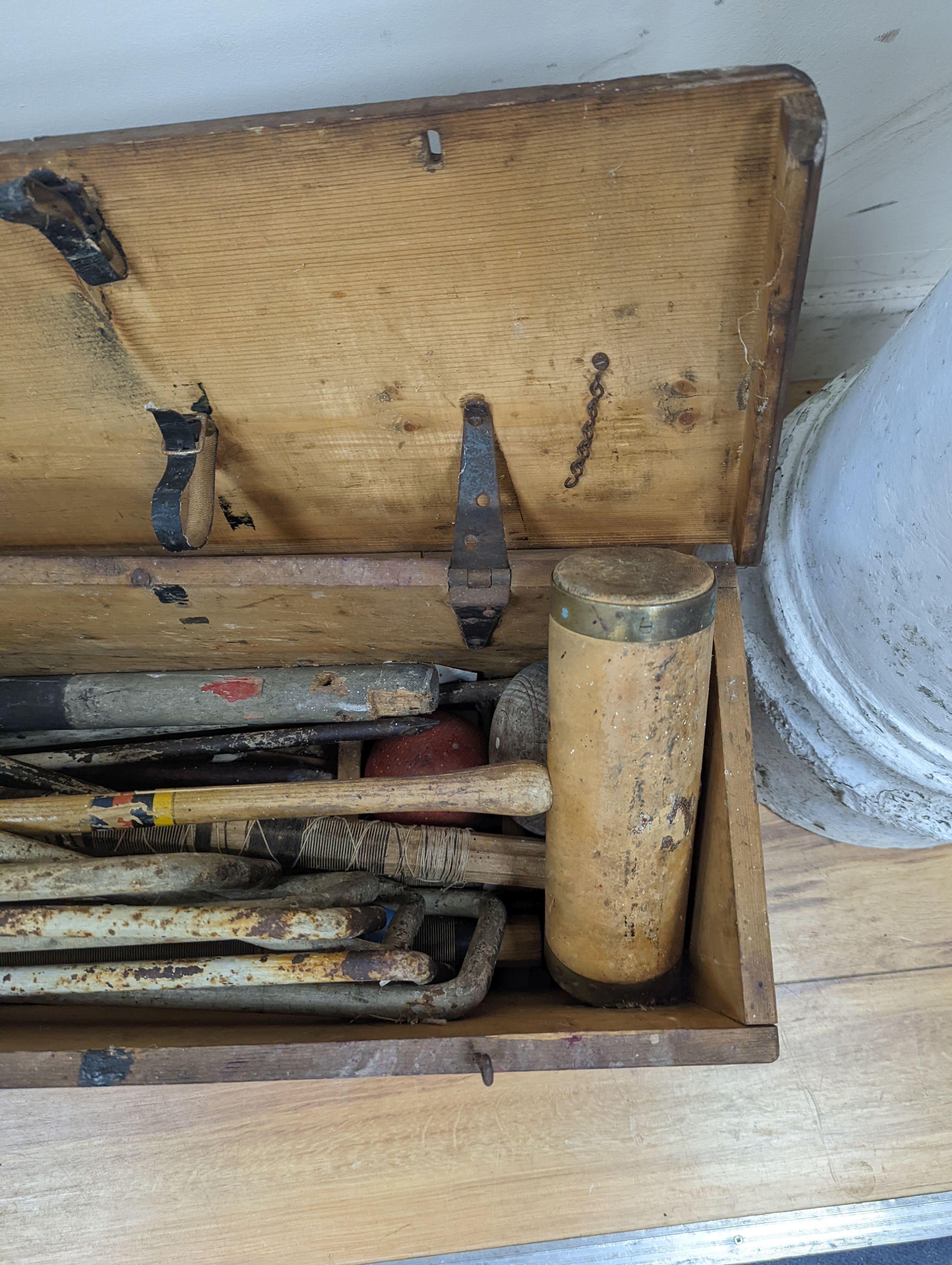 A vintage croquet set in original box